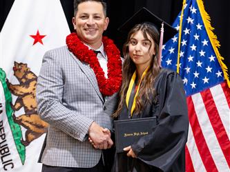 futures principal posing with graduating student