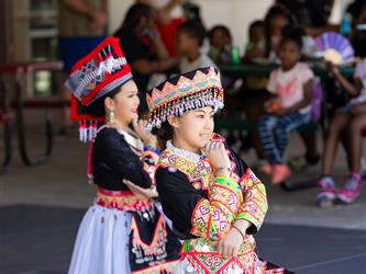 2 students dancing in cultural attire