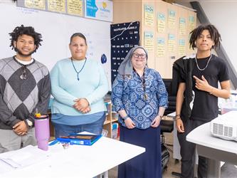 students and teachers posed together