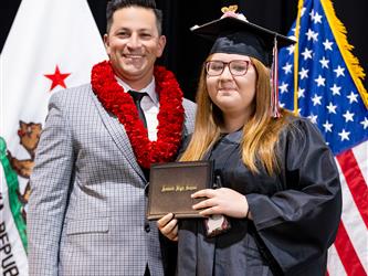 futures principal posing with graduating student