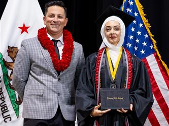 futures principal posing with graduating student