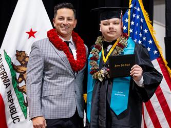 futures principal posing with graduating student