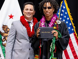 futures principal posing with graduating student