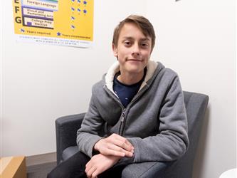 student sitting in chair 